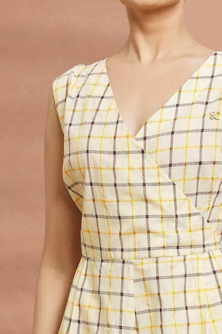 Naintara Bajaj Yellow Cotton V-neck Checked Over-lap Jumpsuit at Aza Fashions Naintara Bajaj_Yellow Cotton V-neck Checked Over-lap Jumpsuit _at_Aza_Fashions
