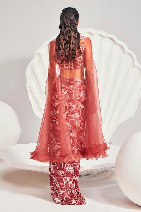 Shop Divya Aggarwal Red Satin Sequins, Beads, Pearls Organza Embellished Cape And Knotted Skirt Set at Aza Fashions Shop_Divya Aggarwal_Red Satin Sequins, Beads, Pearls Organza Embellished Cape And Knotted Skirt Set _at_Aza_Fashions