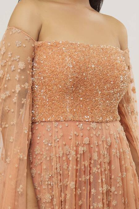 Shop COUTURE BY NIHARIKA Orange Net, Viscose Sequins, Embroidery Off-shoulder Off Gown Online at Aza Fashions Shop_COUTURE BY NIHARIKA_Orange Net, Viscose Sequins, Embroidery Off-shoulder Off Gown _Online_at_Aza_Fashions