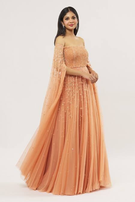 COUTURE BY NIHARIKA Orange Net, Viscose Sequins, Embroidery Off-shoulder Off Gown at Aza Fashions COUTURE BY NIHARIKA_Orange Net, Viscose Sequins, Embroidery Off-shoulder Off Gown _at_Aza_Fashions
