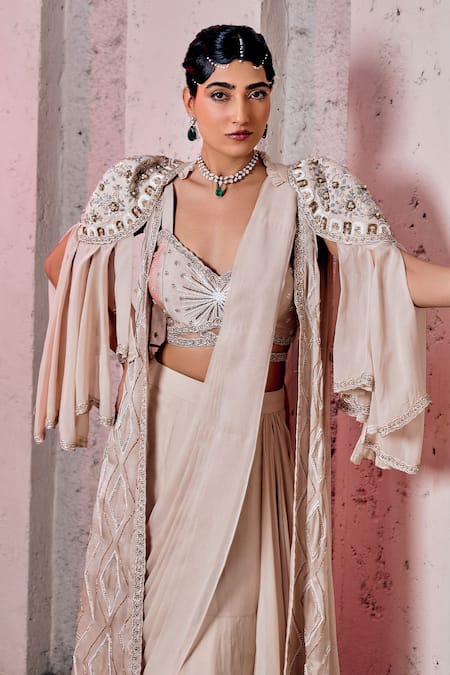 Shop Miku Kumar Ivory Georgette, Viscose Embroidery Layered Cape And Pre-draped Lehenga Saree Set Online at Aza Fashions Shop_Miku Kumar_Ivory Georgette, Viscose Embroidery Layered Cape And Pre-draped Lehenga Saree Set _Online_at_Aza_Fashions
