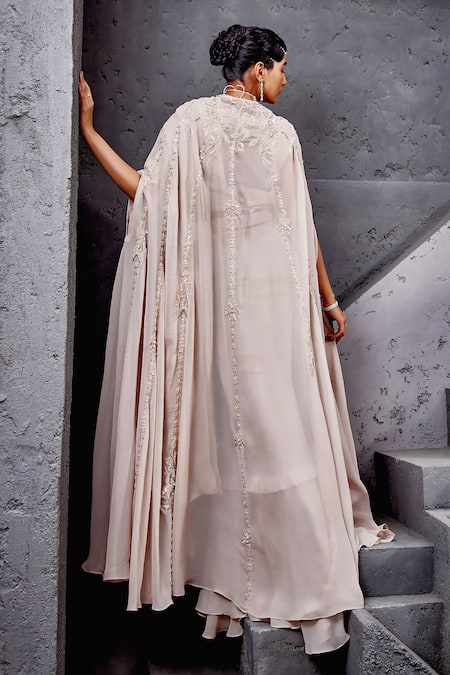 Shop Miku Kumar Ivory Georgette, Net Embroidery, Tassels Cape And Pre-draped Ruffle Saree Set at Aza Fashions Shop_Miku Kumar_Ivory Georgette, Net Embroidery, Tassels Cape And Pre-draped Ruffle Saree Set _at_Aza_Fashions