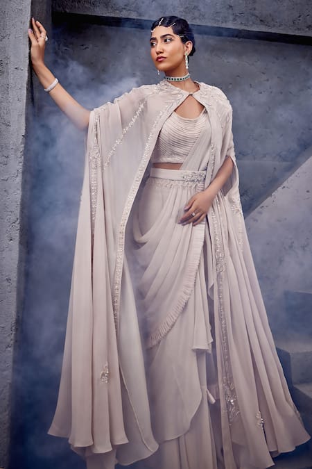 Miku Kumar Ivory Georgette, Net Embroidery, Tassels Cape And Pre-draped Ruffle Saree Set Online at Aza Fashions Miku Kumar_Ivory Georgette, Net Embroidery, Tassels Cape And Pre-draped Ruffle Saree Set _Online_at_Aza_Fashions
