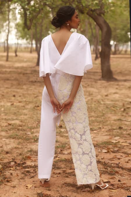 Shop_COUCHÉ By Anandini_Ivory Cotton, Lycra, Lace Embroidery V-neck Floral Draped Jumpsuit _at_Aza_Fashions