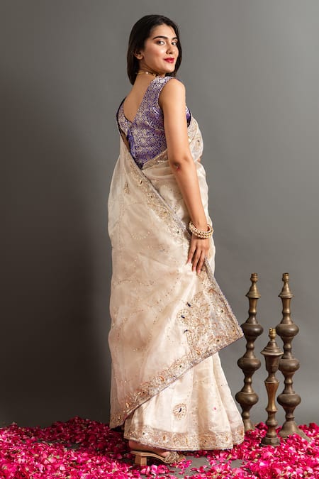 Shop Ruar India White Tissue Sequins, Zari Gokharu Mor Zardozi Embroidered Saree With Blouse at Aza Fashions Shop_Ruar India_White Tissue Sequins, Zari Gokharu Mor Zardozi Embroidered Saree With Blouse _at_Aza_Fashions
