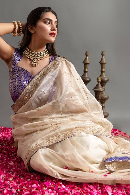 Ruar India White Tissue Sequins, Zari Gokharu Mor Zardozi Embroidered Saree With Blouse Online at Aza Fashions Ruar India_White Tissue Sequins, Zari Gokharu Mor Zardozi Embroidered Saree With Blouse _Online_at_Aza_Fashions