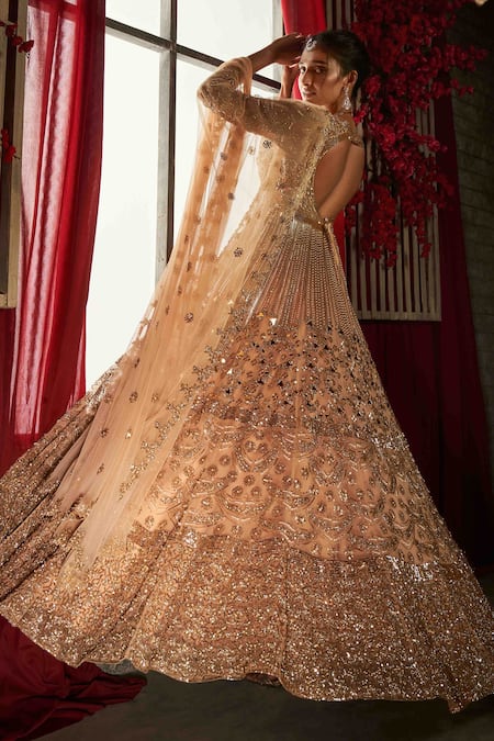 Shop Annus Creation Peach Net Sequins, Pearls V-neck Cut Dana Embroidered Anarkali Lehenga Set at Aza Fashions Shop_Annus Creation_Peach Net Sequins, Pearls V-neck Cut Dana Embroidered Anarkali Lehenga Set_at_Aza_Fashions