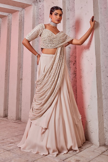 Buy Miku Kumar Ivory Silk, Net, Georgette Sequins V-neck Embroidered Draped Choli And Lehenga Set Online at Aza Fashions Buy_Miku Kumar_Ivory Silk, Net, Georgette Sequins V-neck Embroidered Draped Choli And Lehenga Set _Online_at_Aza_Fashions