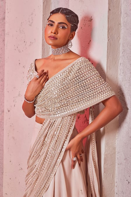 Shop Miku Kumar Ivory Silk, Net, Georgette Sequins V-neck Embroidered Draped Choli And Lehenga Set Online at Aza Fashions Shop_Miku Kumar_Ivory Silk, Net, Georgette Sequins V-neck Embroidered Draped Choli And Lehenga Set _Online_at_Aza_Fashions