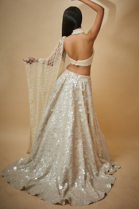 Shop Premya By Manishii White Silk, Chiffon, Tulle Sequins Halter Neck Hand Embroidered Lehenga Set at Aza Fashions Shop_Premya By Manishii_White Silk, Chiffon, Tulle Sequins Halter Neck Hand Embroidered Lehenga Set _at_Aza_Fashions