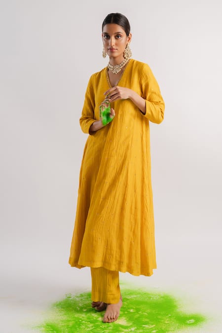 Buy Tussah By Siddhi Shah Yellow Chanderi Hand Embroidered Sequins V A-line Kurta And Pant Set at Aza Fashions Buy_Tussah By Siddhi Shah_Yellow Chanderi Hand Embroidered Sequins V A-line Kurta And Pant Set _at_Aza_Fashions