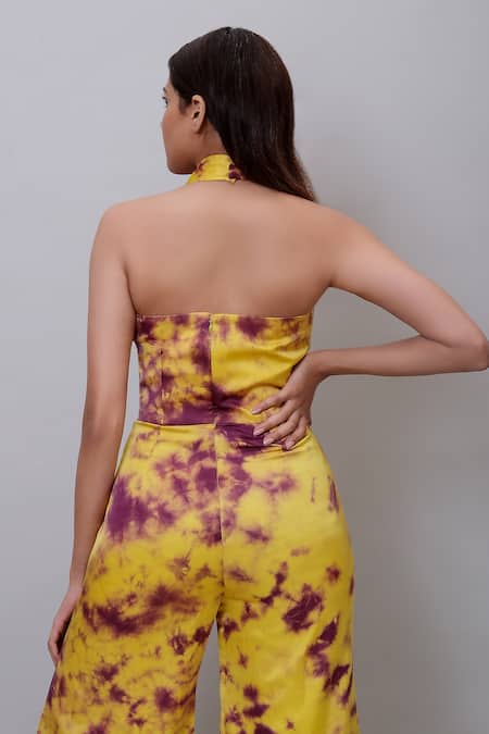 Shop_Nayantaara_Yellow Bamboo Halter Neck Abstract Tie Dye Flared Jumpsuit _Online_at_Aza_Fashions