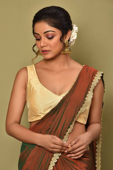 Samyukta Singhania_Gold Silk Lace Asymmetric Border Embroidered Sleeveless Blouse_Online_at_Aza_Fashions