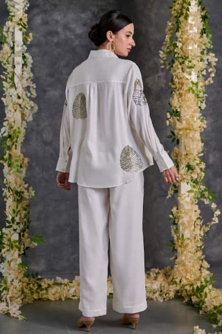 Shop Gulaal White Cotton Sequins Shawl Neck Palm Leaves Embroidered Shirt And Pant Set at Aza Fashions Shop_Gulaal_White Cotton Sequins Shawl Neck Palm Leaves Embroidered Shirt And Pant Set _at_Aza_Fashions