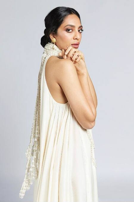 Mala And Kinnary_Ivory Silk Pearls, Beads, Crystals Halter Neck Mala Embroidered High Gown_at_Aza_Fashions