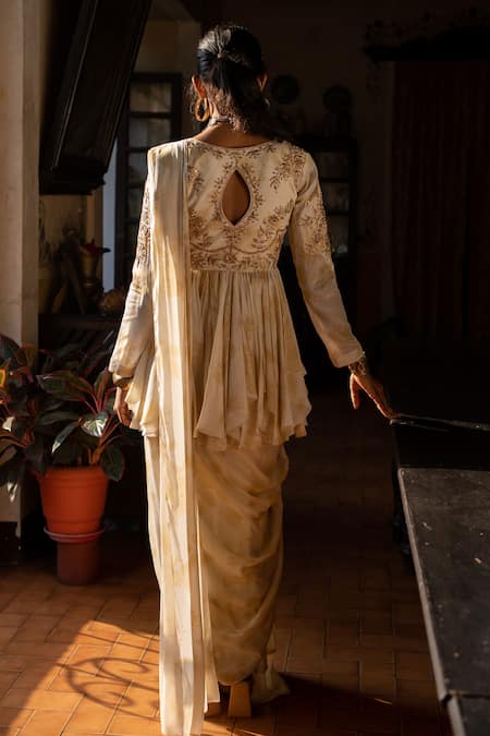 Shop Paulmi And Harsh Ivory Crepe Zari, Embroidery Pre-stitched Saree With Embellished Peplum Top at Aza Fashions Shop_Paulmi And Harsh_Ivory Crepe Zari, Embroidery Pre-stitched Saree With Embellished Peplum Top _at_Aza_Fashions