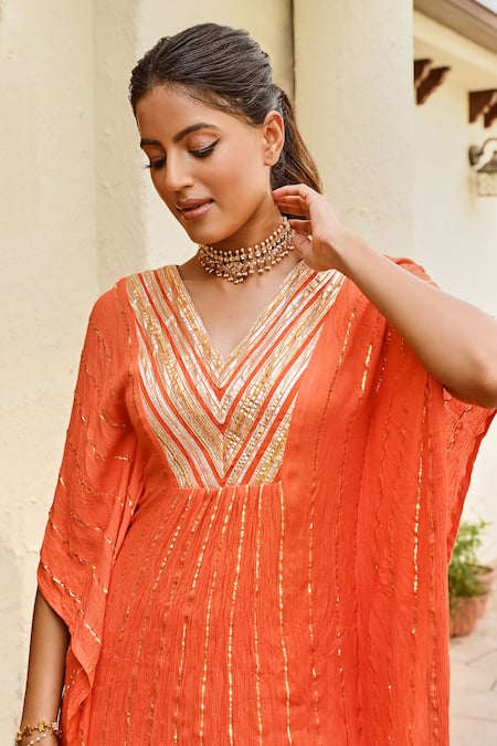 Palak & Mehak_Orange Rayon, Crepe, Lurex Zari V-neck Mira Stripe Pattern Kaftan With Sharara _at_Aza_Fashions