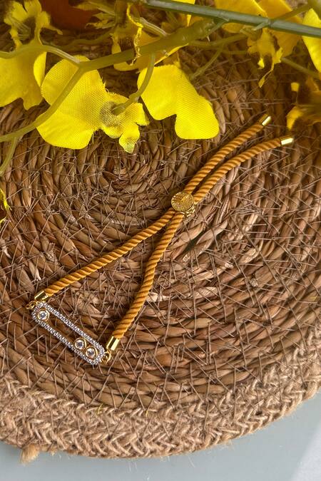 Ttyohar Yellow Faux Diamond Embellished Dancing Stone Rakhi