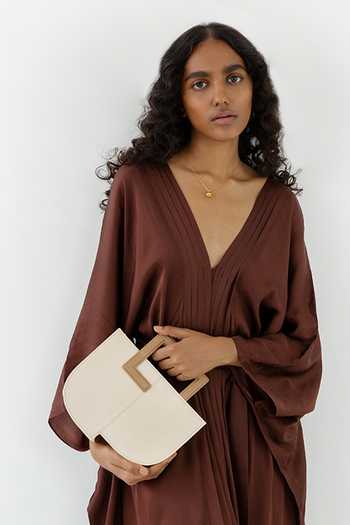 Buy Adisee Ivory Donna Structured Leather Bag at Aza Fashions Buy_Adisee_Ivory Donna Structured Leather Bag_at_Aza_Fashions