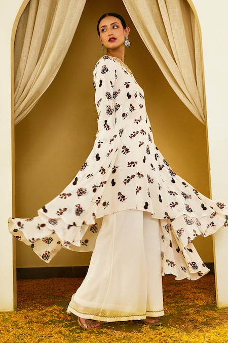 Shop Nikasha Ivory Viscose, Crepe, Georgette Floral Print High Low Kurta With Sharara at Aza Fashions Shop_Nikasha_Ivory Viscose, Crepe, Georgette Floral Print High Low Kurta With Sharara _at_Aza_Fashions