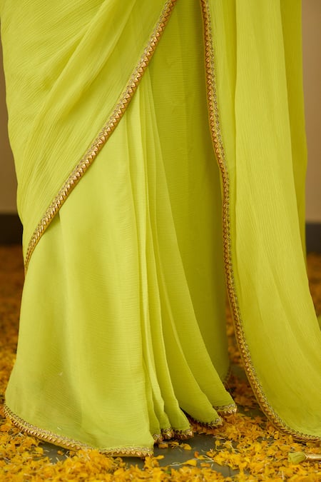Shop Nikasha Green Silk, Chiffon Sequins, Tassels Round Neck Saree With Embroidered Blouse Online at Aza Fashions Shop_Nikasha_Green Silk, Chiffon Sequins, Tassels Round Neck Saree With Embroidered Blouse _Online_at_Aza_Fashions