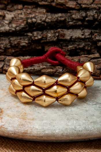 Shop Neeta Boochra Gold Plated Beads Dholki Paunchi Bracelet at Aza Fashions Shop_Neeta Boochra_Gold Plated Beads Dholki Paunchi Bracelet_at_Aza_Fashions