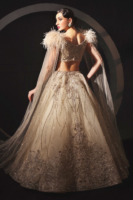 Shop Amit GT Gold Tulle Sequins, Embroidery, Feathers Pema Hand Lehenga And Blouse Set at Aza Fashions Shop_Amit GT_Gold Tulle Sequins, Embroidery, Feathers Pema Hand Lehenga And Blouse Set _at_Aza_Fashions