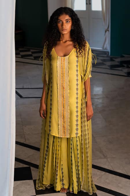 Shop 17:17 By Simmi Saboo Yellow Chiffon Hamsa Kurta Scoop Neck Oscar Pattern Palazzo Set at Aza Fashions Shop_17:17 By Simmi Saboo_Yellow Chiffon Hamsa Kurta Scoop Neck Oscar Pattern Palazzo Set _at_Aza_Fashions