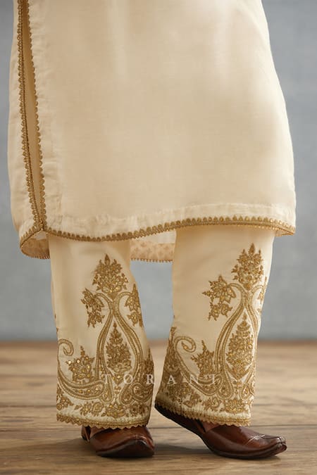 Torani_Ivory Cotton, Silk Embroidery, Lace Split V-neck Gul Bano Pushti Dori Kurta Set _Online_at_Aza_Fashions