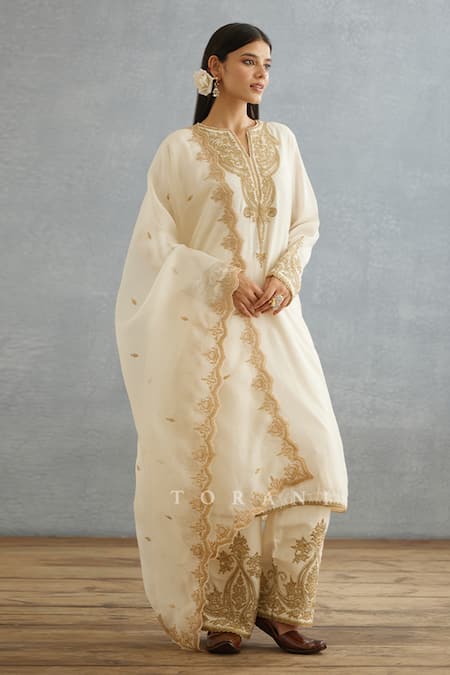 Torani_Ivory Cotton, Silk Embroidery, Lace Split V-neck Gul Bano Pushti Dori Kurta Set _at_Aza_Fashions