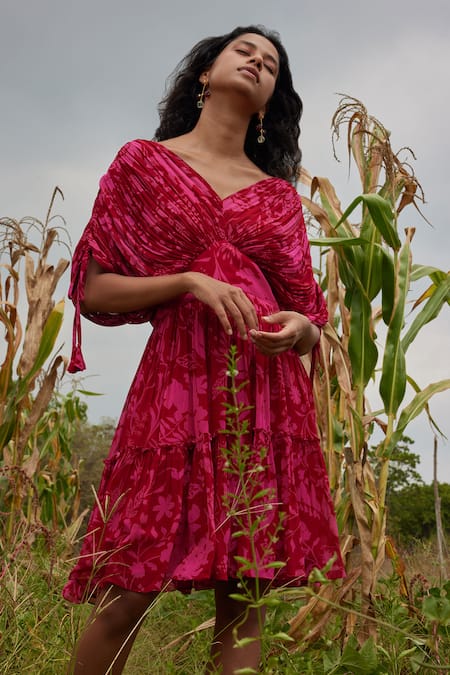 Shop Twinkle Hanspal Fuchsia Georgette Ribbons V-neck Sylvie Micro Pleated Printed Short Dress at Aza Fashions Shop_Twinkle Hanspal_Fuchsia Georgette Ribbons V-neck Sylvie Micro Pleated Printed Short Dress_at_Aza_Fashions