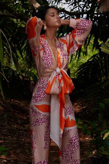 Twinkle Hanspal_Multi Color Handloom Cotton Plunge Neck Eden Palm Print Tie-up Jumpsuit_Online_at_Aza_Fashions