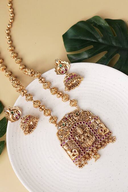 Shop_Curio Cottage_Gold Plated Temple, Embellished Carved Goddess Laxmi Pendant Necklace Set_at_Aza_Fashions