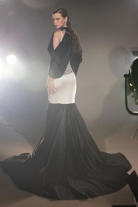 Shop Manika Nanda Black German Satin Solid Gown Natasha Flounce With Batwing Drape at Aza Fashions Shop_Manika Nanda_Black German Satin Solid Gown Natasha Flounce With Batwing Drape _at_Aza_Fashions