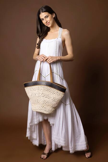 X Feet Above_Ivory Handwoven Leh Raffia Tote Bag _Online_at_Aza_Fashions