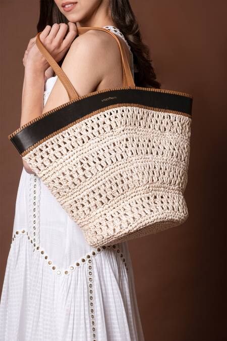 Buy_X Feet Above_Ivory Handwoven Leh Raffia Tote Bag _Online_at_Aza_Fashions