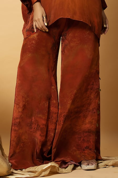 Label Shristi Chetani_Orange Crepe Tassels, Embroidery Halter Abstract Pattern Top And Flared Pant Set _Online_at_Aza_Fashions