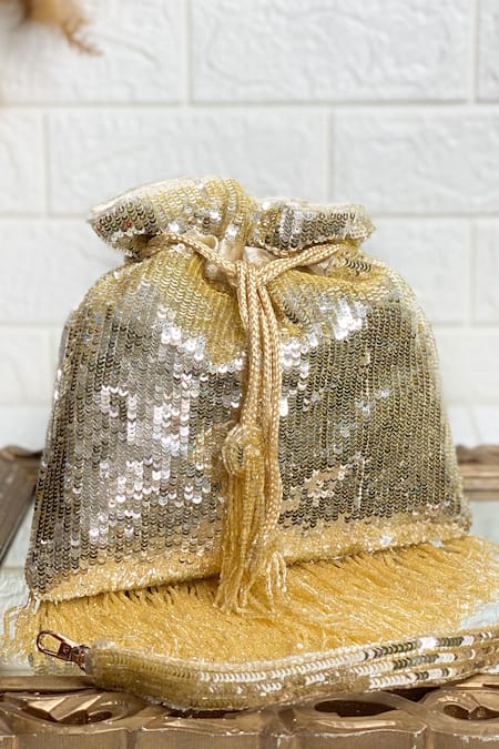 Shop Kainiche By Mehak Gold Embroidery Linear Pattern Potli at Aza Fashions Shop_Kainiche By Mehak_Gold Embroidery Linear Pattern Potli _at_Aza_Fashions