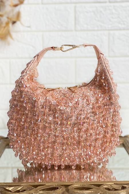 Shop Kainiche By Mehak Pink Embellished Raw Silk Rhinestone Potli at Aza Fashions Shop_Kainiche By Mehak_Pink Embellished Raw Silk Rhinestone Potli _at_Aza_Fashions