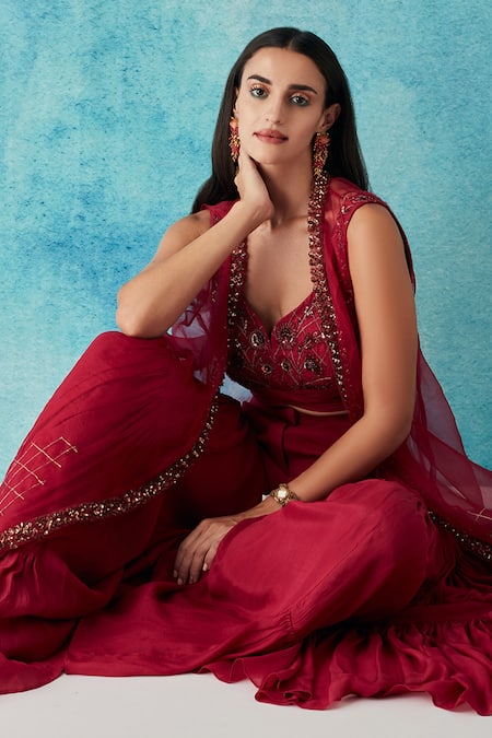 Siyona By Ankurita Red Silk, Chiffon Sequins Asymmetric Embroidered Cape And Layered Sharara Set at Aza Fashions Siyona By Ankurita_Red Silk, Chiffon Sequins Asymmetric Embroidered Cape And Layered Sharara Set _at_Aza_Fashions