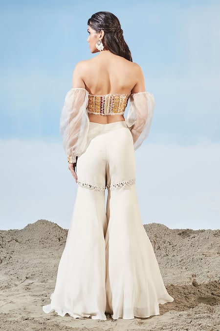 Shop Siyona By Ankurita Ivory Chinnon Embrodiered Geometric Off Shoulder Bustier And Sharara Set at Aza Fashions Shop_Siyona By Ankurita_Ivory Chinnon Embrodiered Geometric Off Shoulder Bustier And Sharara Set _at_Aza_Fashions