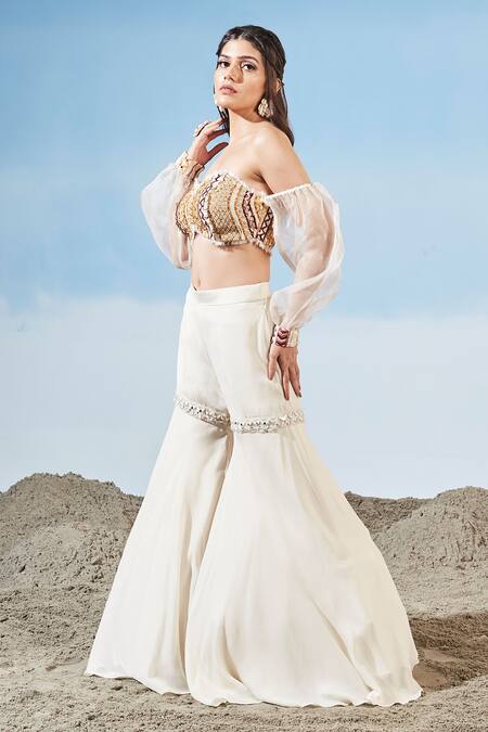 Siyona By Ankurita Ivory Chinnon Embrodiered Geometric Off Shoulder Bustier And Sharara Set Online at Aza Fashions Siyona By Ankurita_Ivory Chinnon Embrodiered Geometric Off Shoulder Bustier And Sharara Set _Online_at_Aza_Fashions