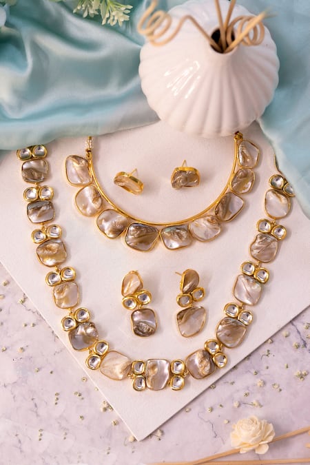 Shop Ishhaara Gold Plated Bows Pearl And Kundan Embellished Necklace Set at Aza Fashions Shop_Ishhaara_Gold Plated Bows Pearl And Kundan Embellished Necklace Set _at_Aza_Fashions