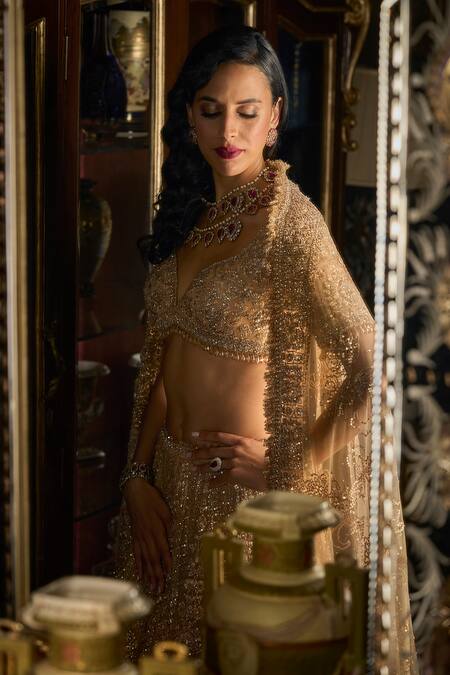 Seema Gujral_Gold Net Crystals, Sequins, Beads, Embroidery Flower Bridal Lehenga Set _at_Aza_Fashions