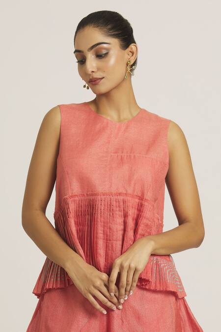 Urvashi Kaur_Coral Tissue, Silk Round Neck Stripe Pattern Peplum Top _at_Aza_Fashions