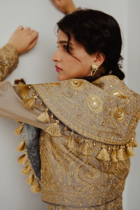 Wabi Sabi By Anshum-Ritesh Grey Tissue Tassels V-neck Golden Feather Embroidered Cape Jacket With Anarkali at Aza Fashions Wabi Sabi By Anshum-Ritesh_Grey Tissue Tassels V-neck Golden Feather Embroidered Cape Jacket With Anarkali _at_Aza_Fashions