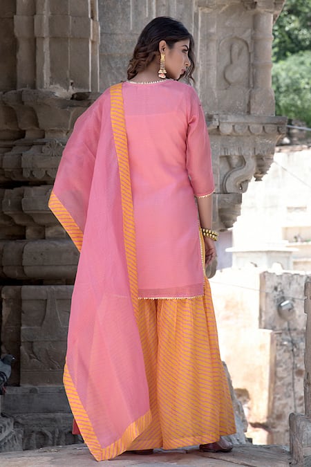 Shop The Home Affair Peach Kota Doria Patti Round Neck Leheriya Striped Gharara Kurta Set at Aza Fashions Shop_The Home Affair_Peach Kota Doria Patti Round Neck Leheriya Striped Gharara Kurta Set _at_Aza_Fashions
