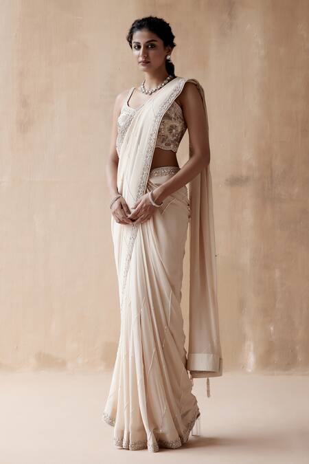 Buy Aman Takyar Ivory Georgette Pearls, Cut Work Asymmetric Border Embroidered Saree With Blouse Online at Aza Fashions Buy_Aman Takyar_Ivory Georgette Pearls, Cut Work Asymmetric Border Embroidered Saree With Blouse _Online_at_Aza_Fashions