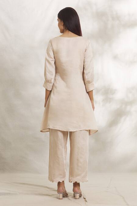 Shop Anaya By Akruthi Beige Satin Silk Hand Painted Lotus Leaf Neck Kurta And Pant Set at Aza Fashions Shop_Anaya By Akruthi_Beige Satin Silk Hand Painted Lotus Leaf Neck Kurta And Pant Set_at_Aza_Fashions