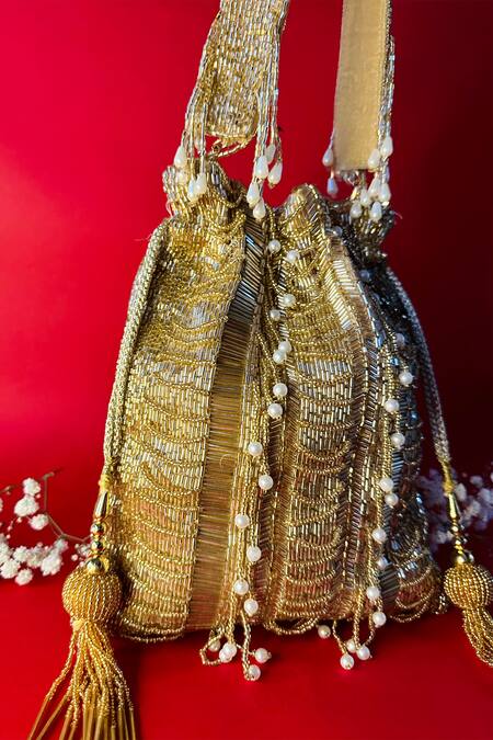 Buy_Nayaab By Sonia_Gold Cut Work, Pearls Briller Sac Twin Embellished Potli_Online_at_Aza_Fashions